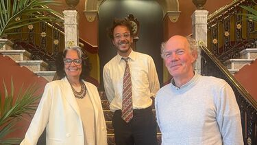 three people on a staircase in classic The Hague hotel: Ida Does, Raoul de Jong and Duco van Oostrum