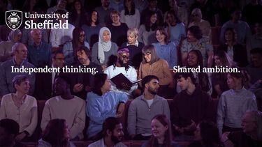 Image shows a group of University of Sheffield students and staff members gathered in a lecture theatre. Two of them are illuminated by a spotlight looking at a book. The image contains the University of Sheffield logo and the text "Independent thinking. Shared ambition."