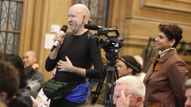 A guest asks a question at the Drag and the Law event