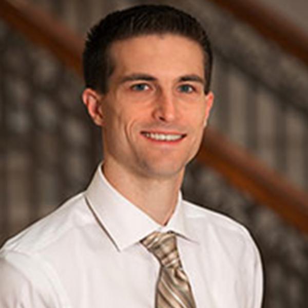 Profile picture of A portrait photo of philosopher T. Ryan Byerly. He is wearing a white shirt and patterned gold tie.