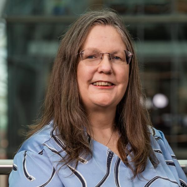 Profile picture of Professor Joan Cordiner smiling as she stands in the Engineering Heartspace