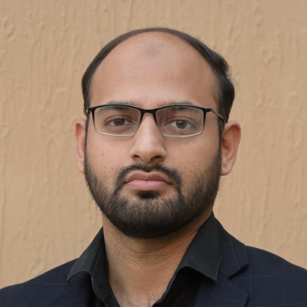 Profile picture of A man wearing a dark shirt and glasses