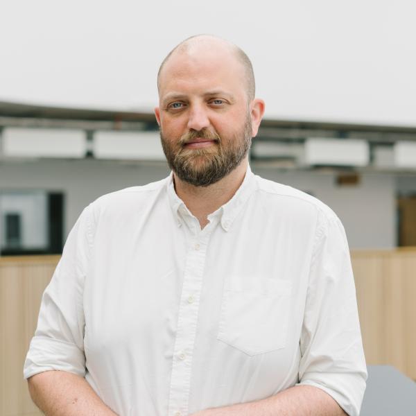 Profile picture of Stuart Hall, SMI Marketing Officer, stood in The Wave Atrium