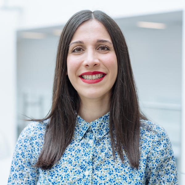 Profile picture of Atefeh Afsari wearing a blue floral shirt.