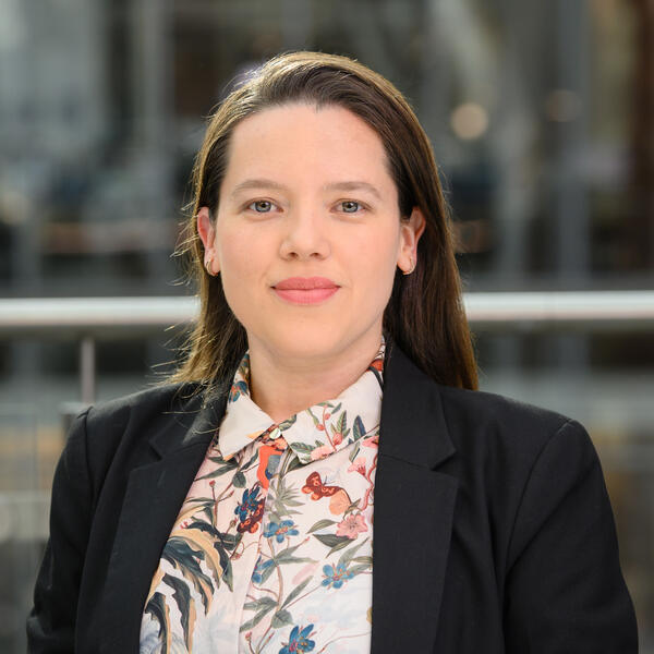 Profile picture of Portrait of a researcher wearing navy blazer and colourful shirt