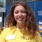 Hannah Dibble, English and History student, smiling at camera stood outside Blackwell's bookshop 