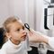 A child having their eyes examined