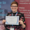 Rachael Green holding a Best paper award certificate.