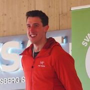 Benjamin Davison in a red jacket, smiling