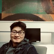 David (Zhe) Chen sits in front of a computer