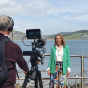 Image of Dr. Victoria Herridge stood by a seafront