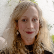 Headshot of Jess Bradley, stood outside