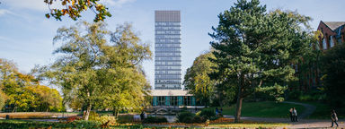 The Arts Tower as seen from Weston Park in the autumn. Western Bank library at the foot of the Arts Tower.