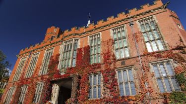 Firth Court with ivy and blue sky