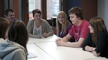 Undergraduate students at table