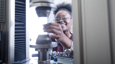 Image of postgraduate Materials Science and Engineering student with equipment 