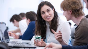 Two postgraduate ACSE students with equipment