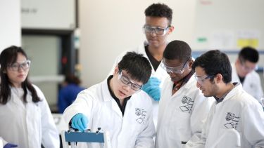 Group of Chemical and Biological Engineering postgraduates doing an experiment