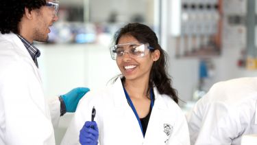 Chemical and Biological Engineering postgraduate in lab wearing goggles
