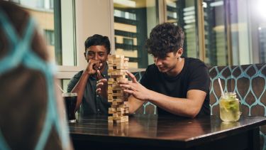 Students playing a game of Jenga  