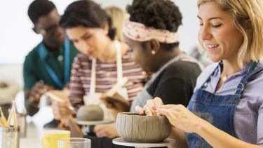 people doing pottery