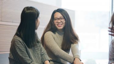 Two SLC students in discussion. 