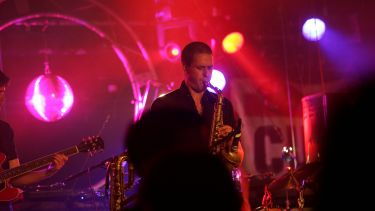 Saxophonist performing on stage
