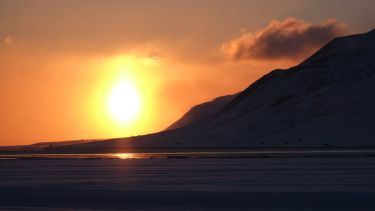 The sun setting over the Arctic.