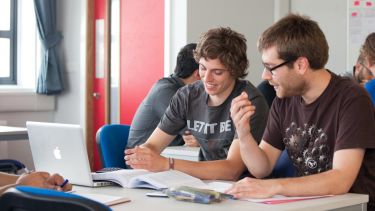 Two students working on a project.