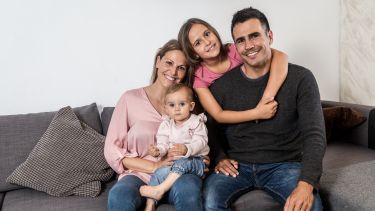 A family photo sat on a sofa 