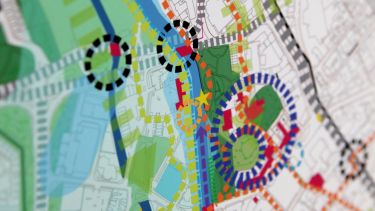 A map showing road layouts, housing, and green spaces - image