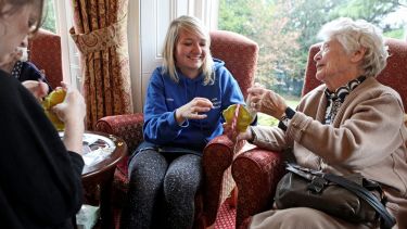 Student volunteering in a care home