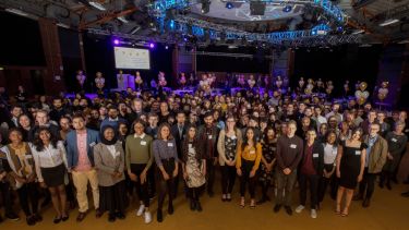 A group of scholarship recipients in the Octagon