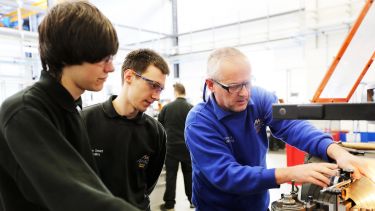 A group of students working hard on an apprenticeship