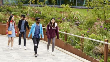 a group of students walk by the Students Unions