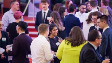 Students and alumni networking in the Crucible Theatre
