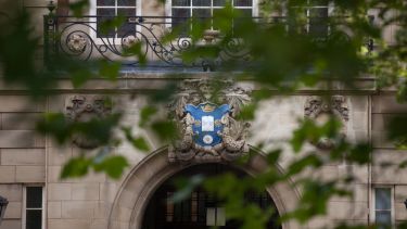 A shot of the university crest over the front door of the Sir Frederic Mappin building.