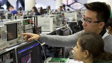 Two students in the Electronics and Control lab in The Diamond lab.