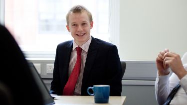 Photo of Richard Mosley Masters student working at the Department for Work and Pensions