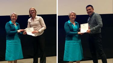 Ning receiving his prize from Professor Wendy Baird and Caroline receiving her prize from Professor Wendy Baird.