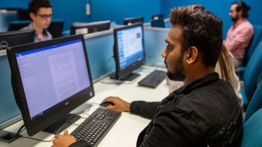 Student on computer in computer lab 