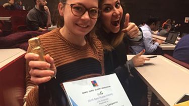 Laura Martinez-Campesino with her certificate and a bottle of champagne. 