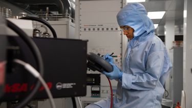 A lab technican using the MBE technique in the National Epitaxy Facility