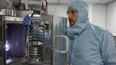 An MBE cluster tool being loaded with devices in the National Epitaxy Facility.