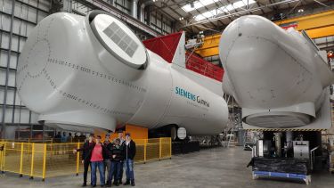 Two bladeless wind turbine motors in the Siemens Gamesa training facility.