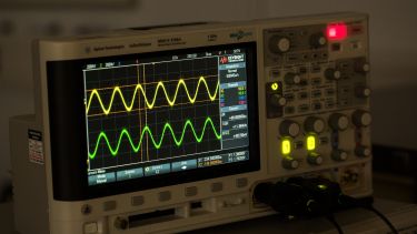 Close up of oscilloscope in use in lab