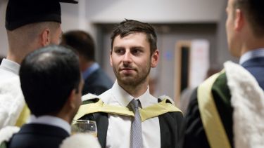 An economics student at graduation - image
