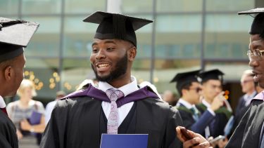 A close up of a student on his graduation day