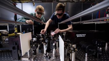Two researchers at the time resolved infrared station in the Ultrafast Laser Spectroscopy Laboratory