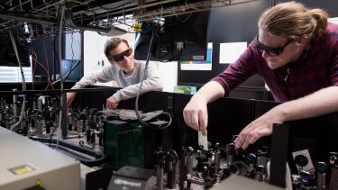 Two researchers in the Ultrafast Laser Spectroscopy Laboratory